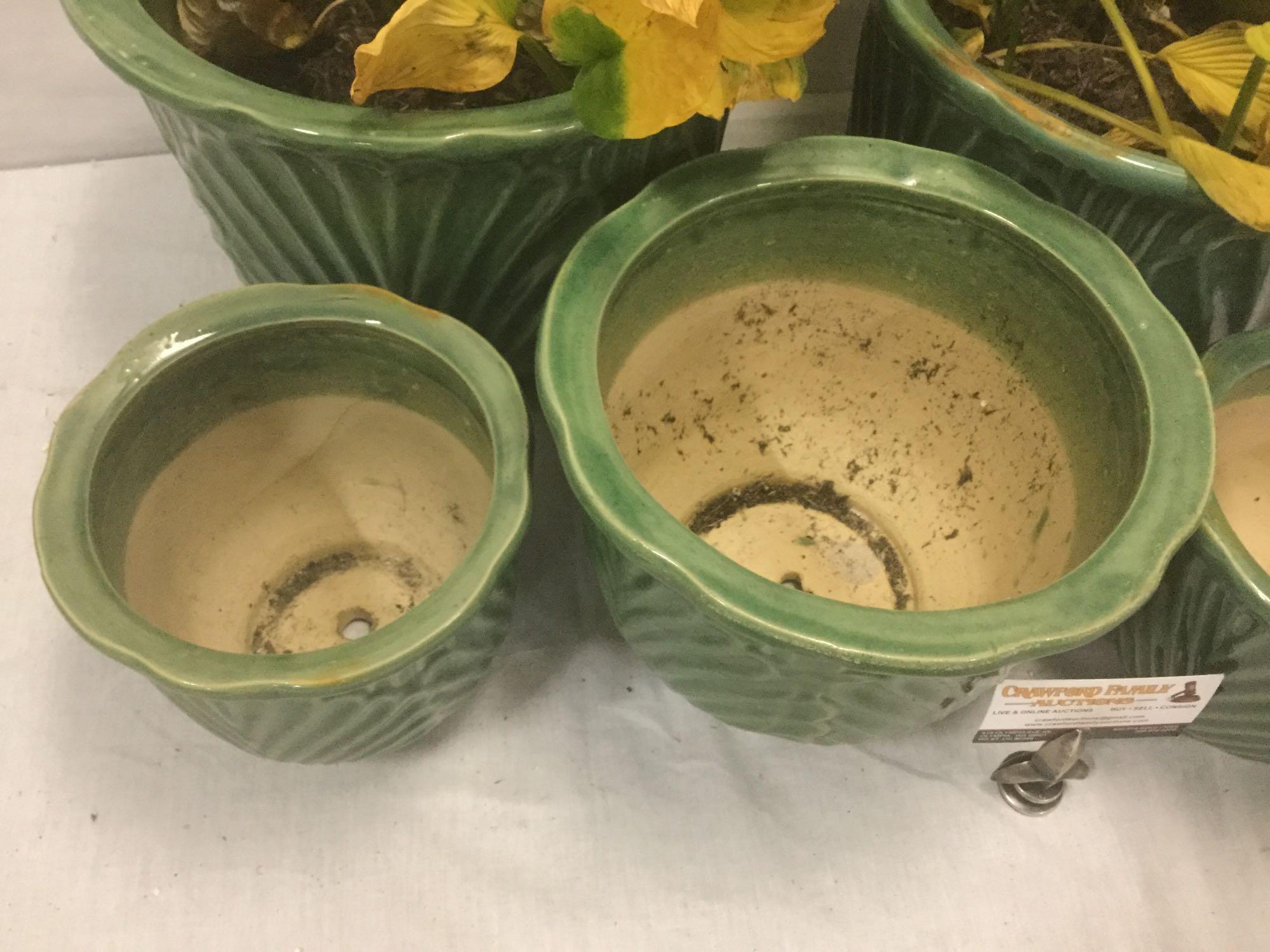 Set of 5 matching green glazed floral design ceramic planters