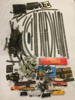 Collection of HO scale model train tracks, train cars, MRC Model Train Controller and accessories