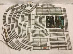 Collection of model train tracks with switcher and transformer base