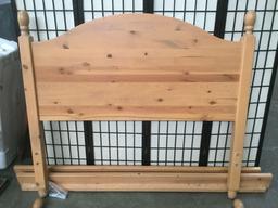 Full size oak bed frame with headboard and rails, approximately 57x52x76 in