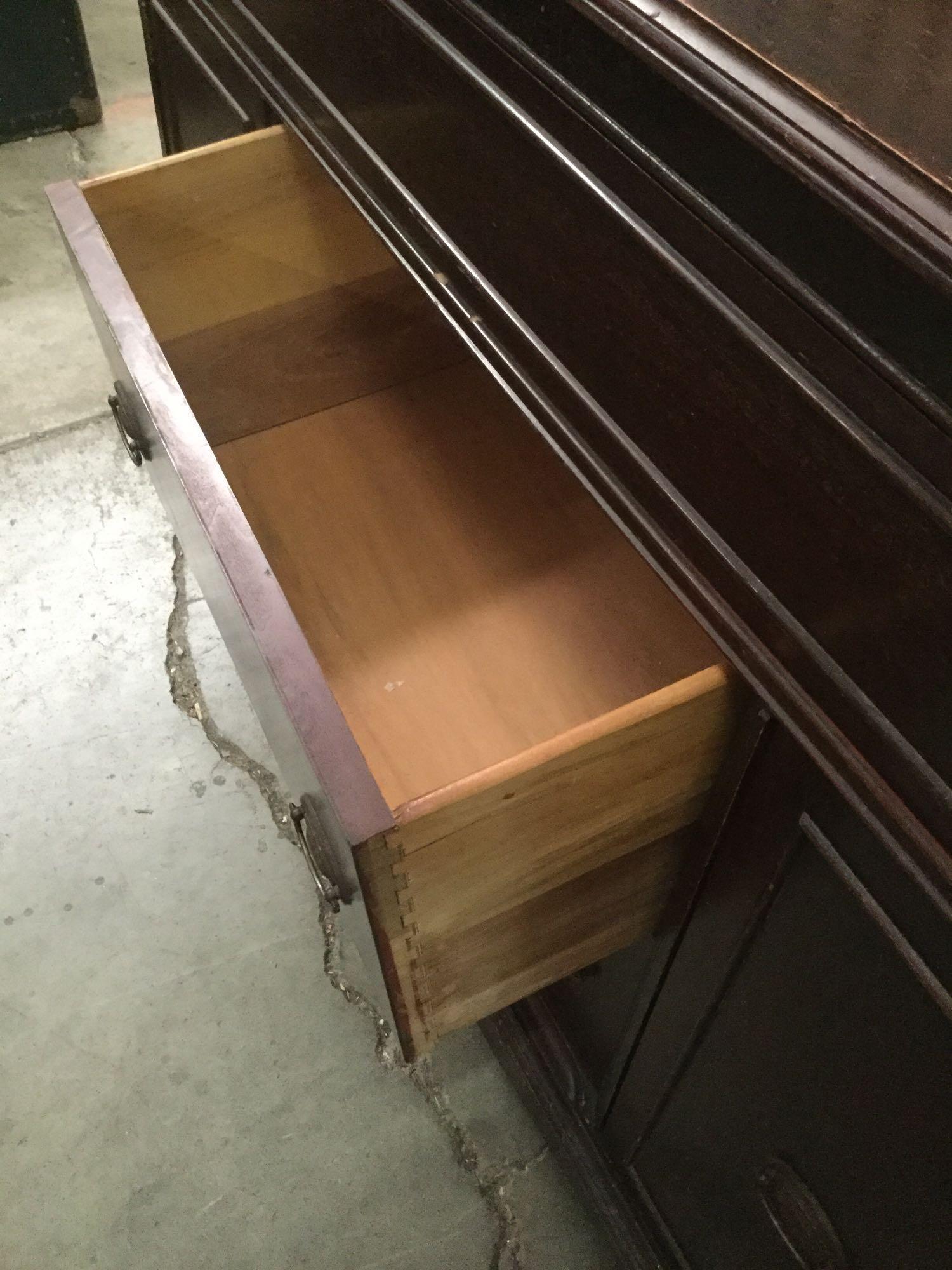 Vintage wooden buffet, shows surface wear, approximately 48x18x37 inches.