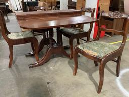 Vintage wood carved dining table w/ 3 leaf extensions, 4 chairs