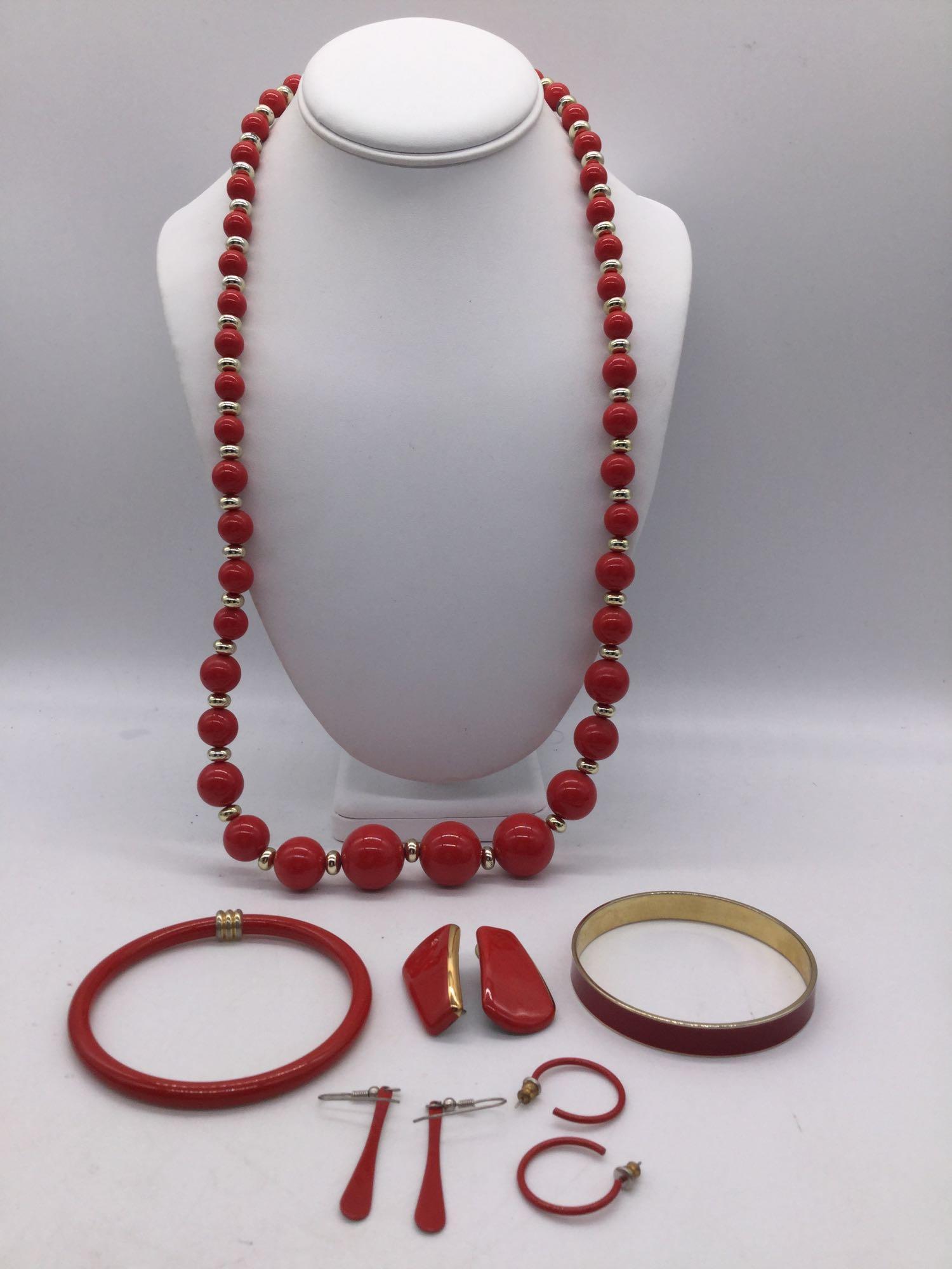 Collection of red and gold tone estate jewelry pieces