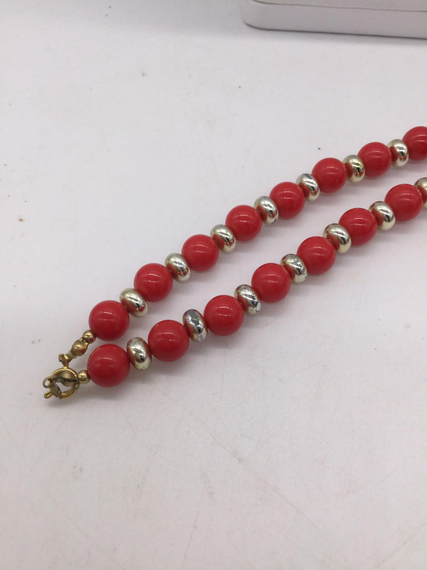 Collection of red and gold tone estate jewelry pieces