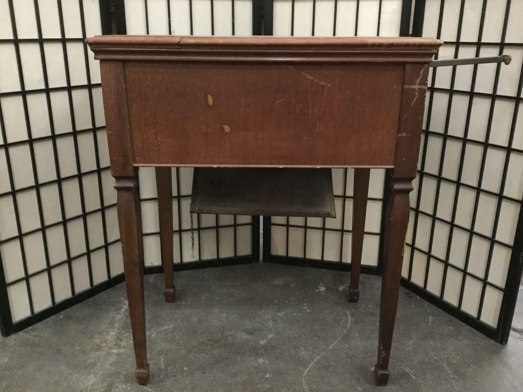 Vintage maple sewing cabinet with no machine, worn top - sold as is