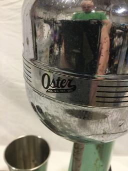 Vintage OSTER milkshake blender w/ steel cups, tested/ needs maintenance. Sold as is.