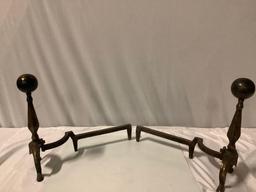 Pair of vintage metal fireplace andirons, approx 20 x 8 x 17 in. each.