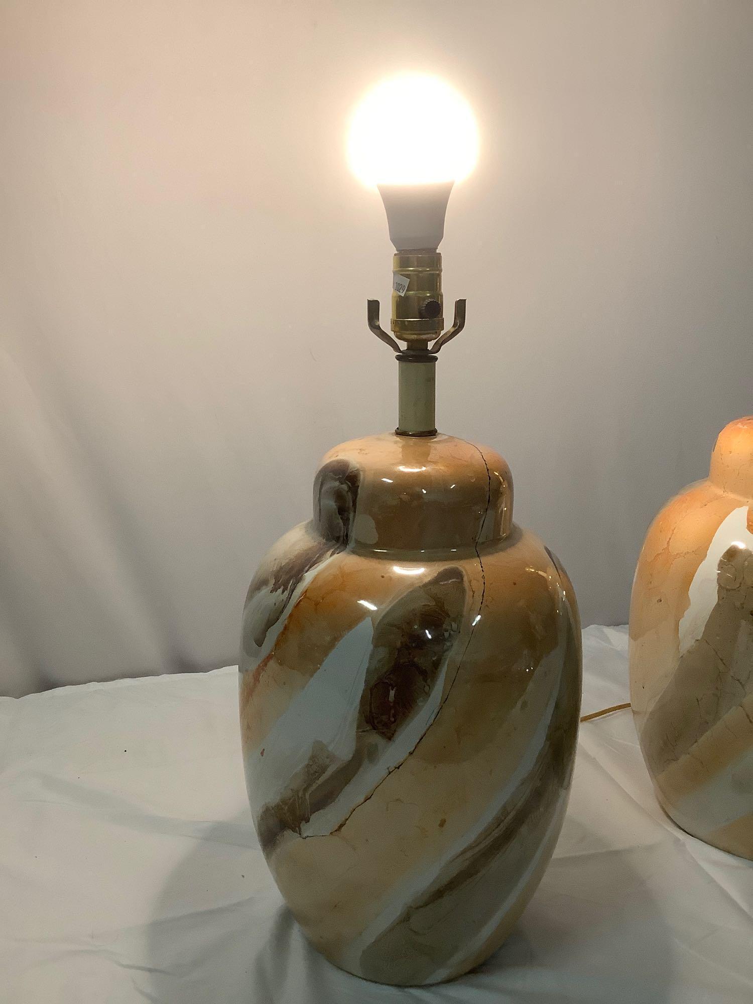 A pair of matching vintage ceramic bass lamps, tested and working, no shades.