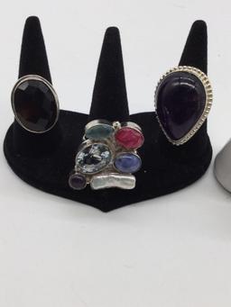 4 large heavy marked .925 silver rings with various stones