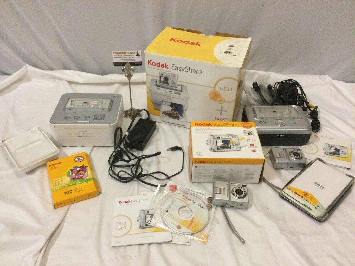 Lot of KODAK Easy Share C533 Digital Cameras plus printer docks. Sold as is.