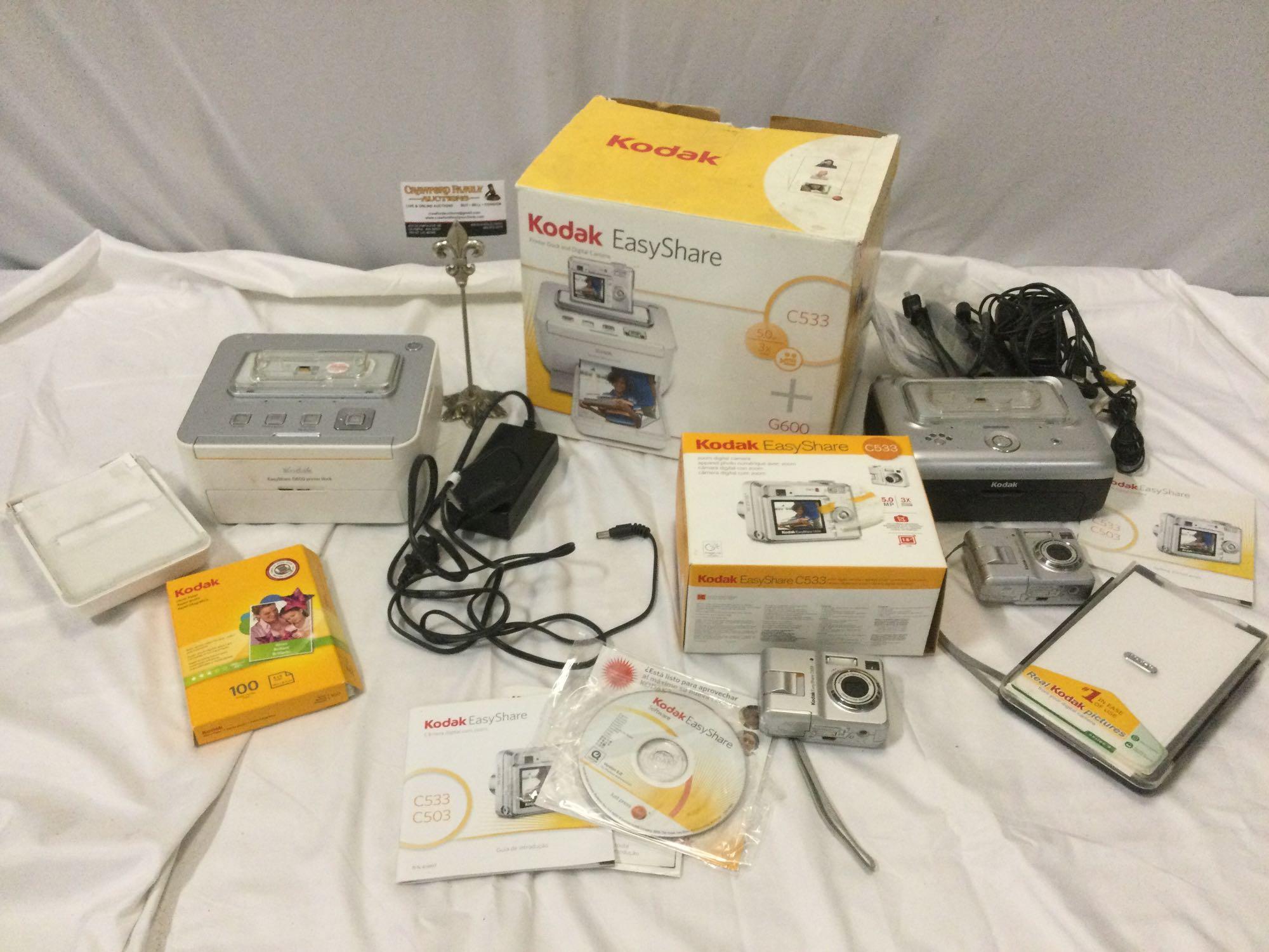 Lot of KODAK Easy Share C533 Digital Cameras plus printer docks. Sold as is.