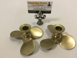 Vintage brass propeller shaped candle holders, approx 5 x 2.5 in.