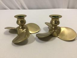 Vintage brass propeller shaped candle holders, approx 5 x 2.5 in.