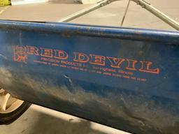 Vintage RED DEVIL lawn fertilizer spreader, tested and working, approx 43 x 25 x 25 in.