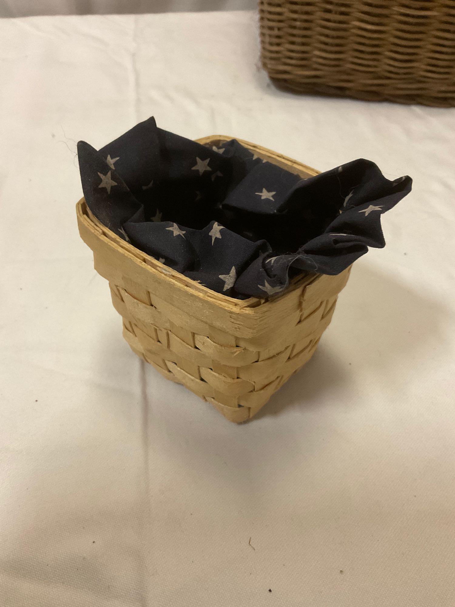 4 pc. lot of vintage woven baskets & wooden earring rack; Longaberger Baskets Collectors Club