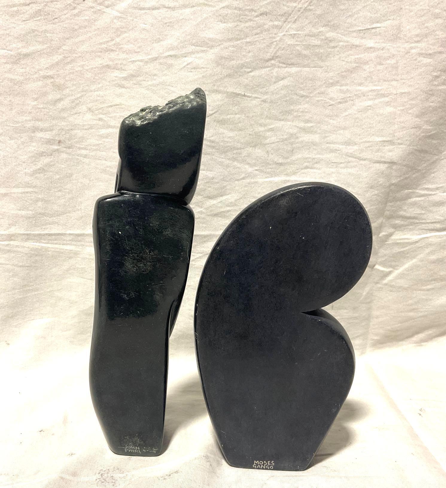Pair of Hand Carved African Stone sculptures of a woman resting and lovers , Signed by the Artist