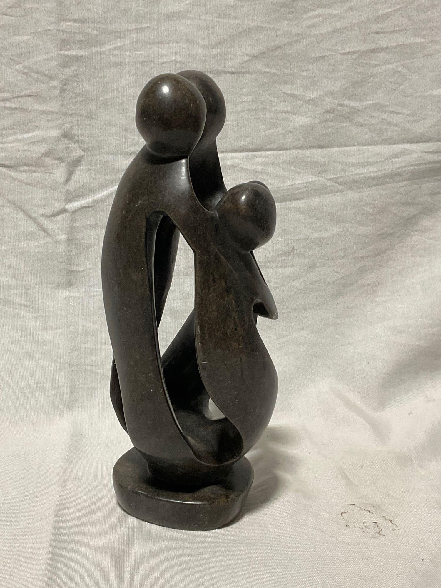 Hand Carved African Stone Sculpture of family , Man, woman, child embracing Signed by Artist