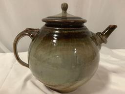 Nice handmade ceramic stoneware tea pot with lid, signed by artist , approx. 9 x 11 in.