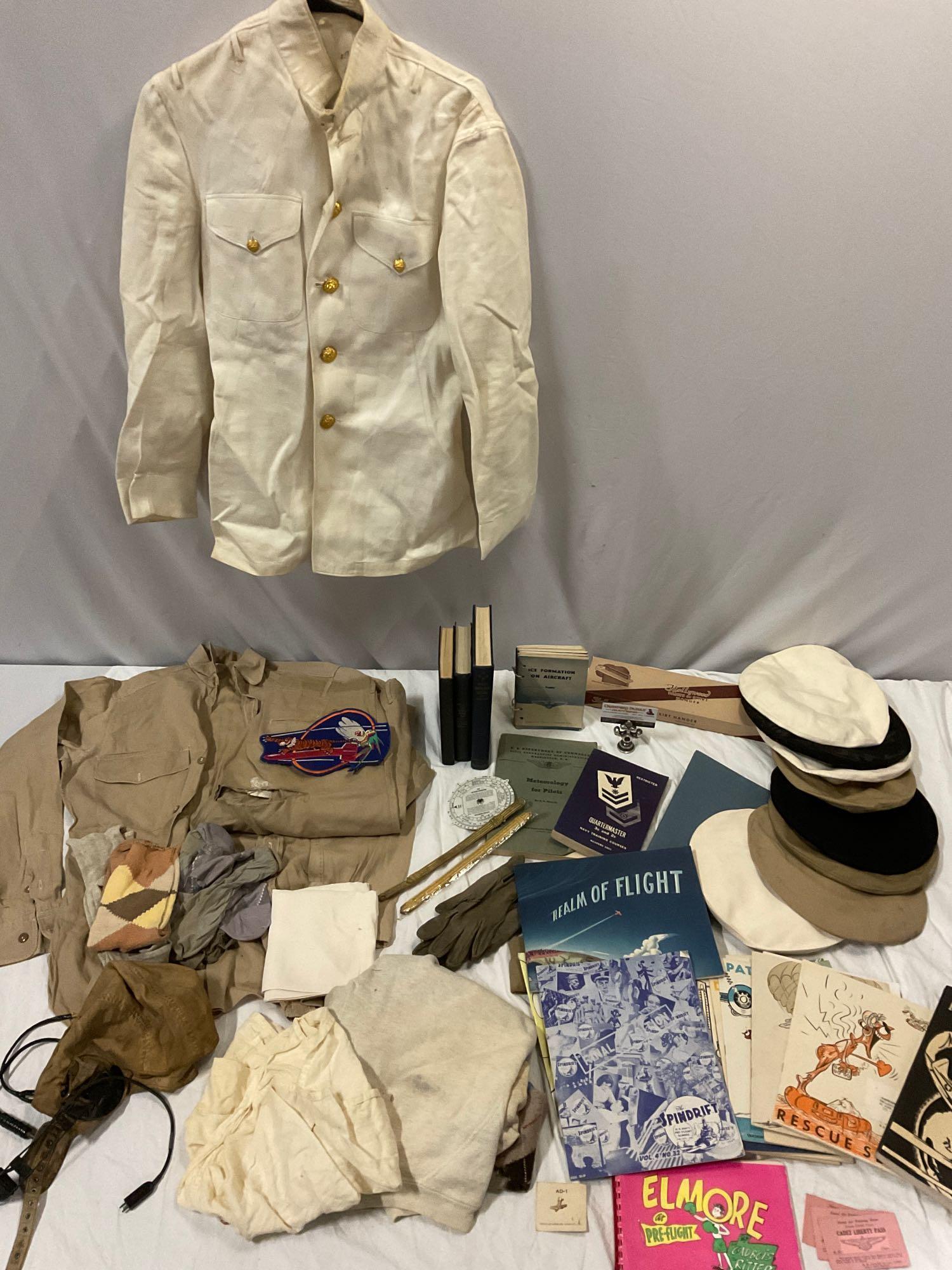 Lot of antique pilot flight uniform, headset, books, booklets, berets, gloves, & more. See pics.