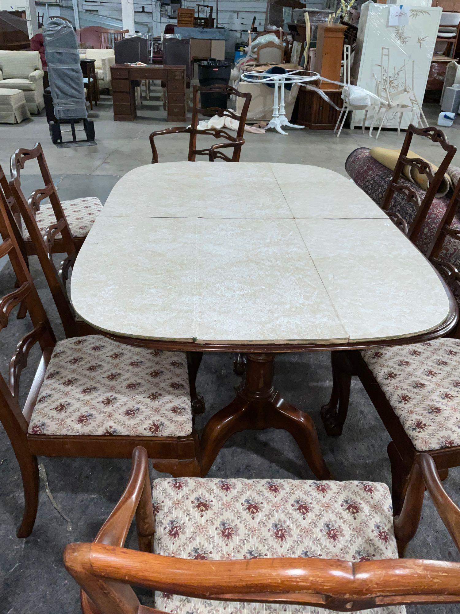 Gorgeous vintage mahogany dining table w/ eagle claw feet and eight chairs, 2 captain, 6 regular