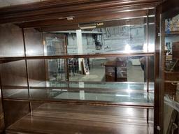 Vintage Oak lighted Display two piece hutch Buffet w/ 2 glass shelves and mirrored back.