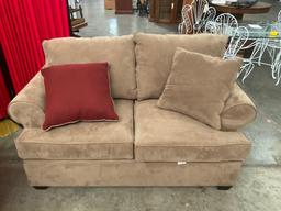 Very nice brown sofa and loveseat combination with reversible pillows, by pacific furniture Oregon