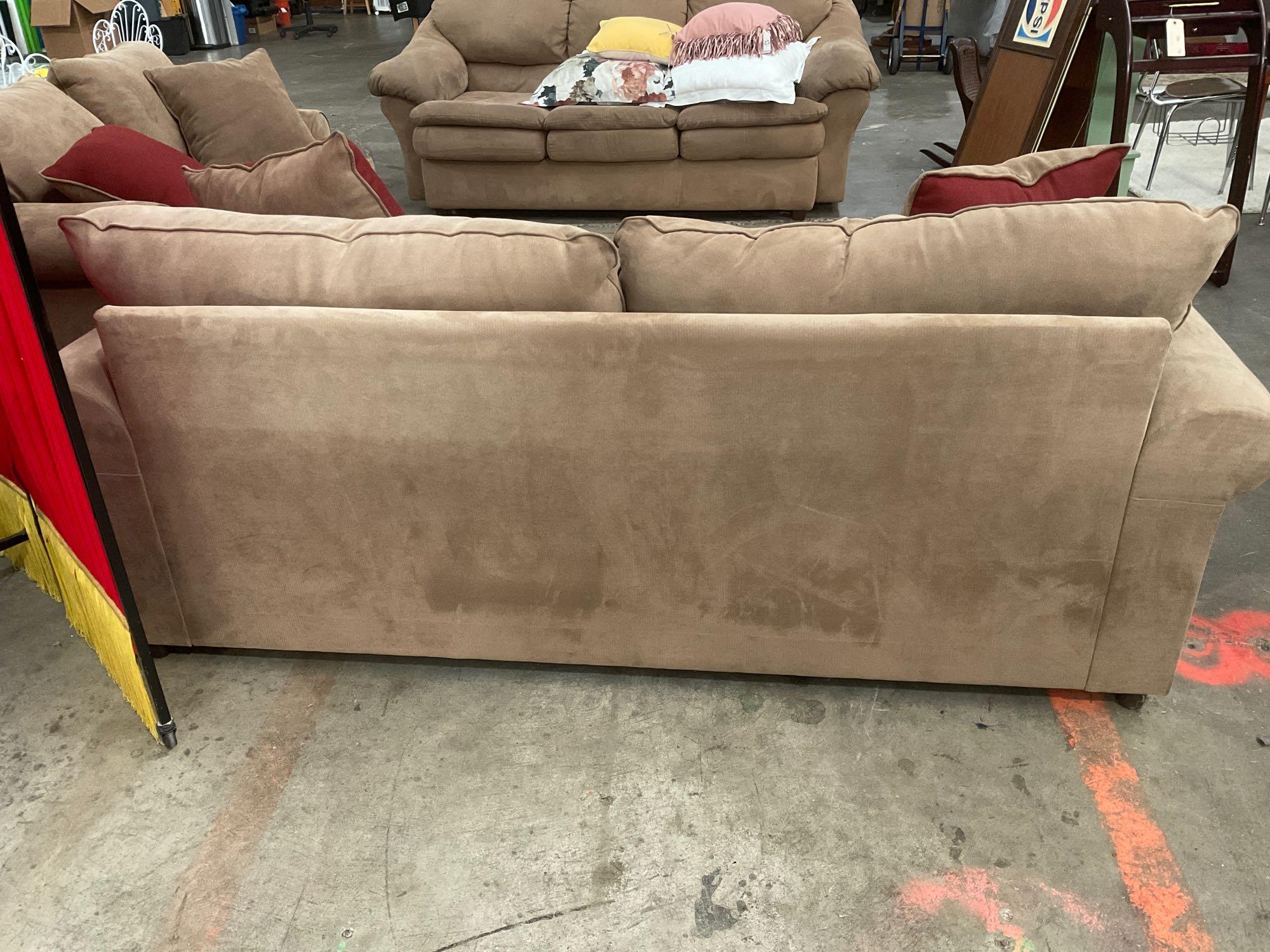 Very nice brown sofa and loveseat combination with reversible pillows, by pacific furniture Oregon