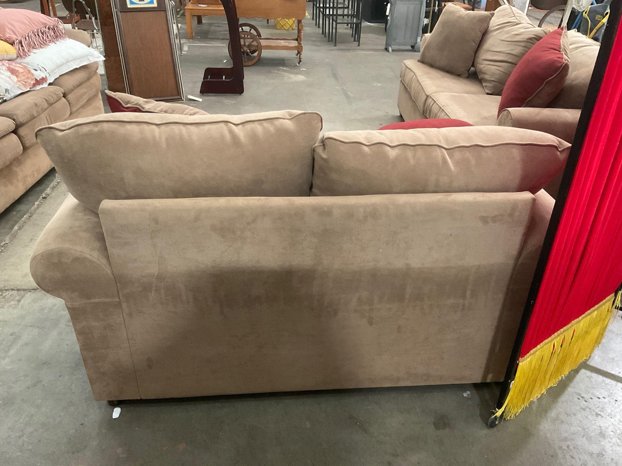 Very nice brown sofa and loveseat combination with reversible pillows, by pacific furniture Oregon