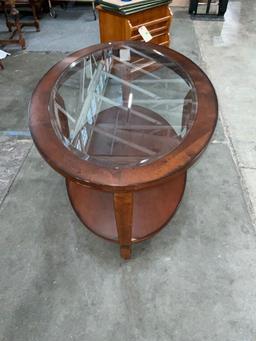 Elegant solid wood oval shaped coffee table with beveled glass top