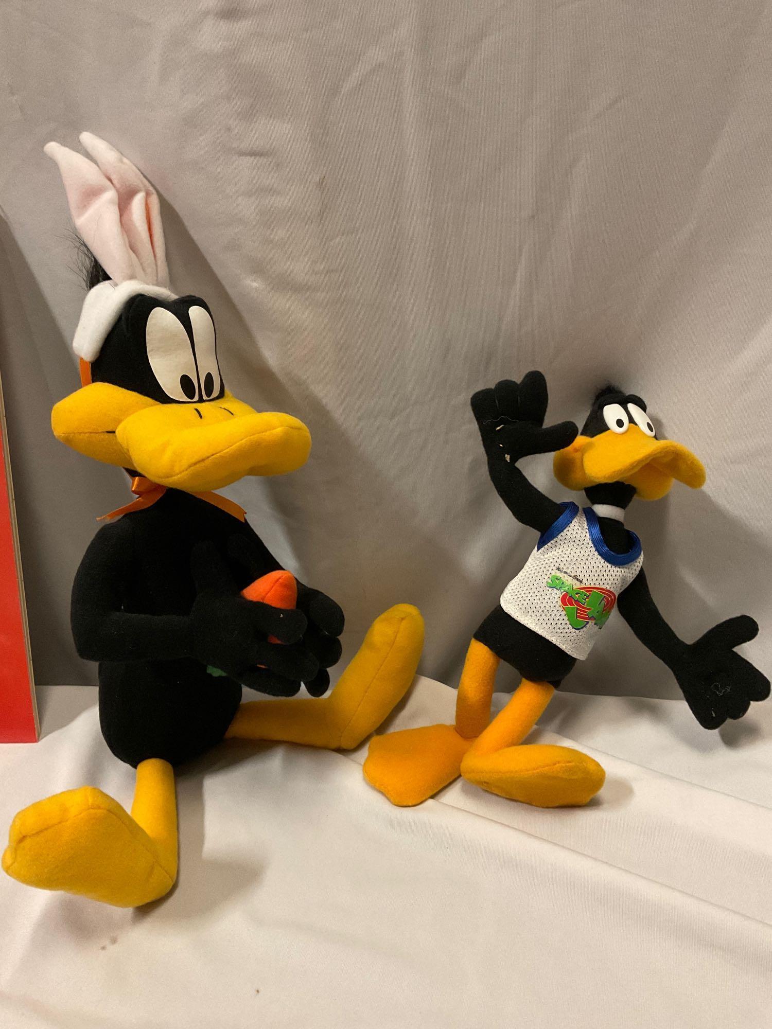 Nice lot of WARNER BROS Looney Tunes cartoon character collectibles; Daffy Duck plush toys, puzzles,