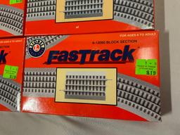 4 pc. lot of Lionel FASTRACK block section train track pieces in box