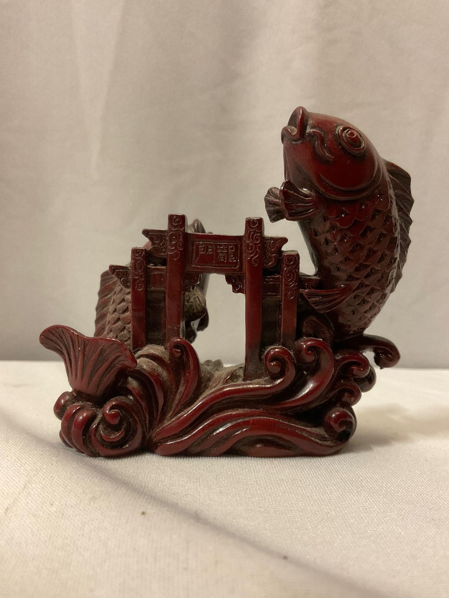 2 pc. lot of red resin Asian sculpted animal figurines; fish & wild stallion horse, approx 3 x 4 in.