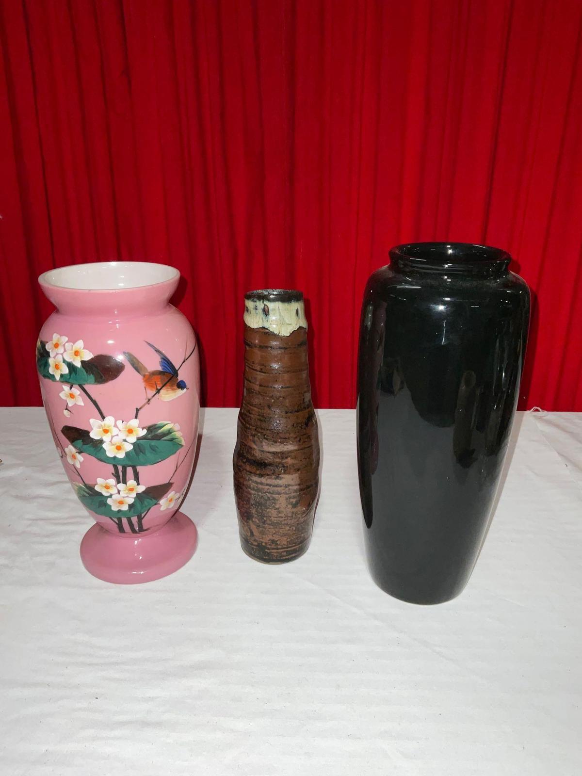 Set of three races, one porcelain W/bird and flower motif, hand thrown pottery, and black ceramic