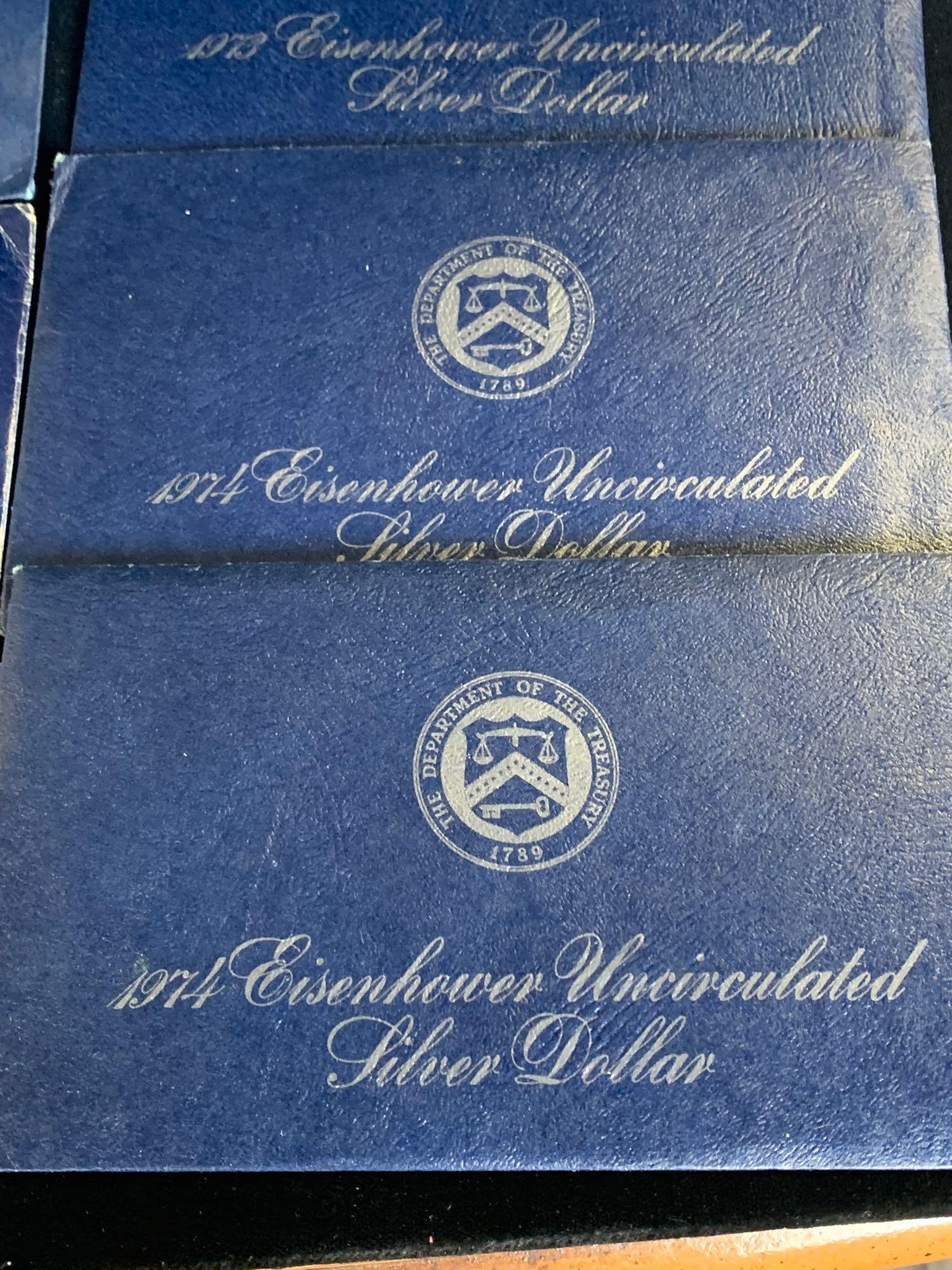 8 x 40% silver Blue Pac Uncirculated Eisenhower Silver dollars /2x 1971/ 2x1972/ 2 x73 & 2x 74