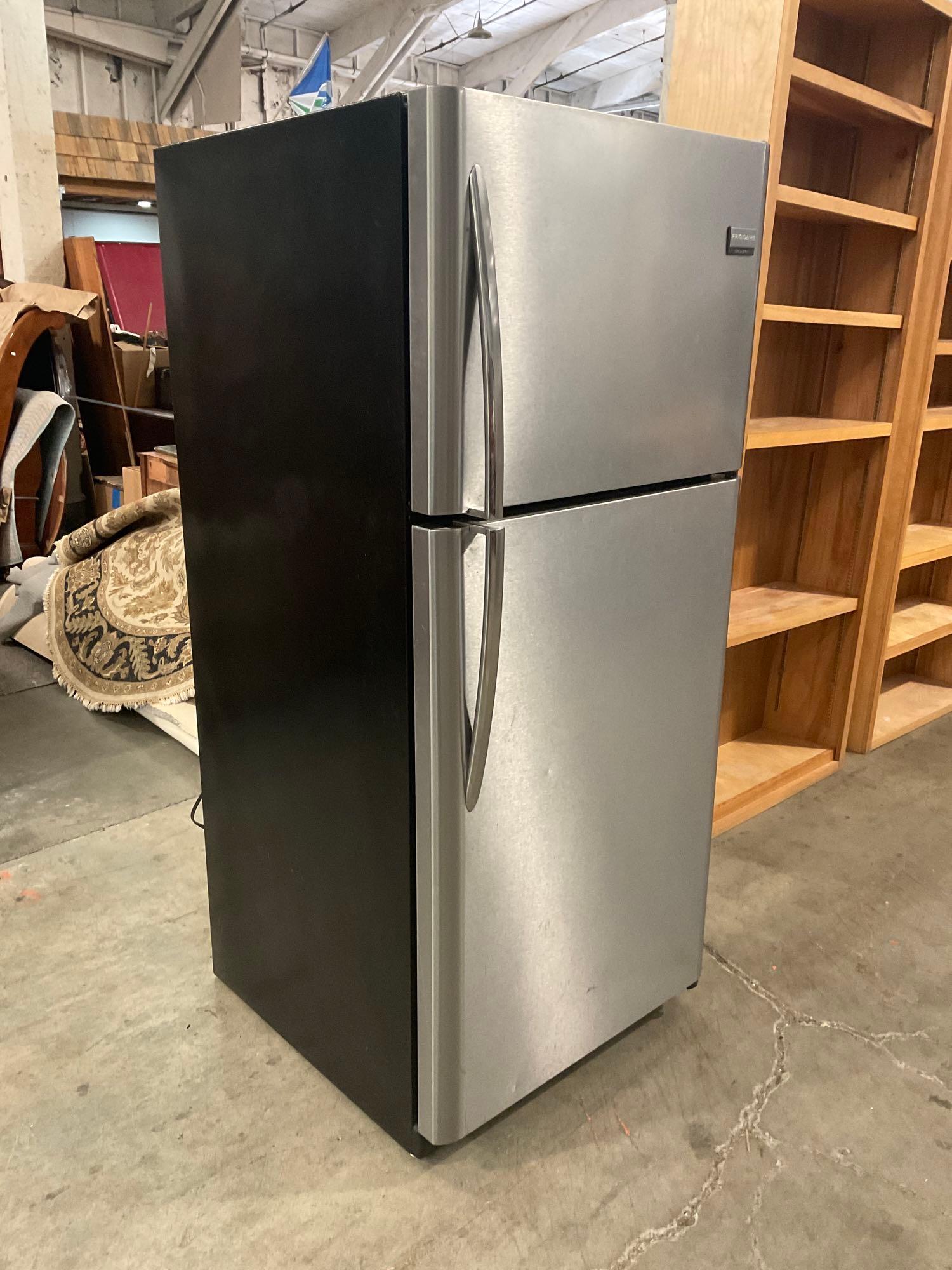 FRIGIDAIRE upright refrigerator/ freezer combo. Model JGHT2137NF4.