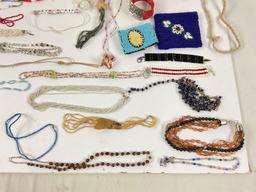 collection of different beaded jewelry and items,