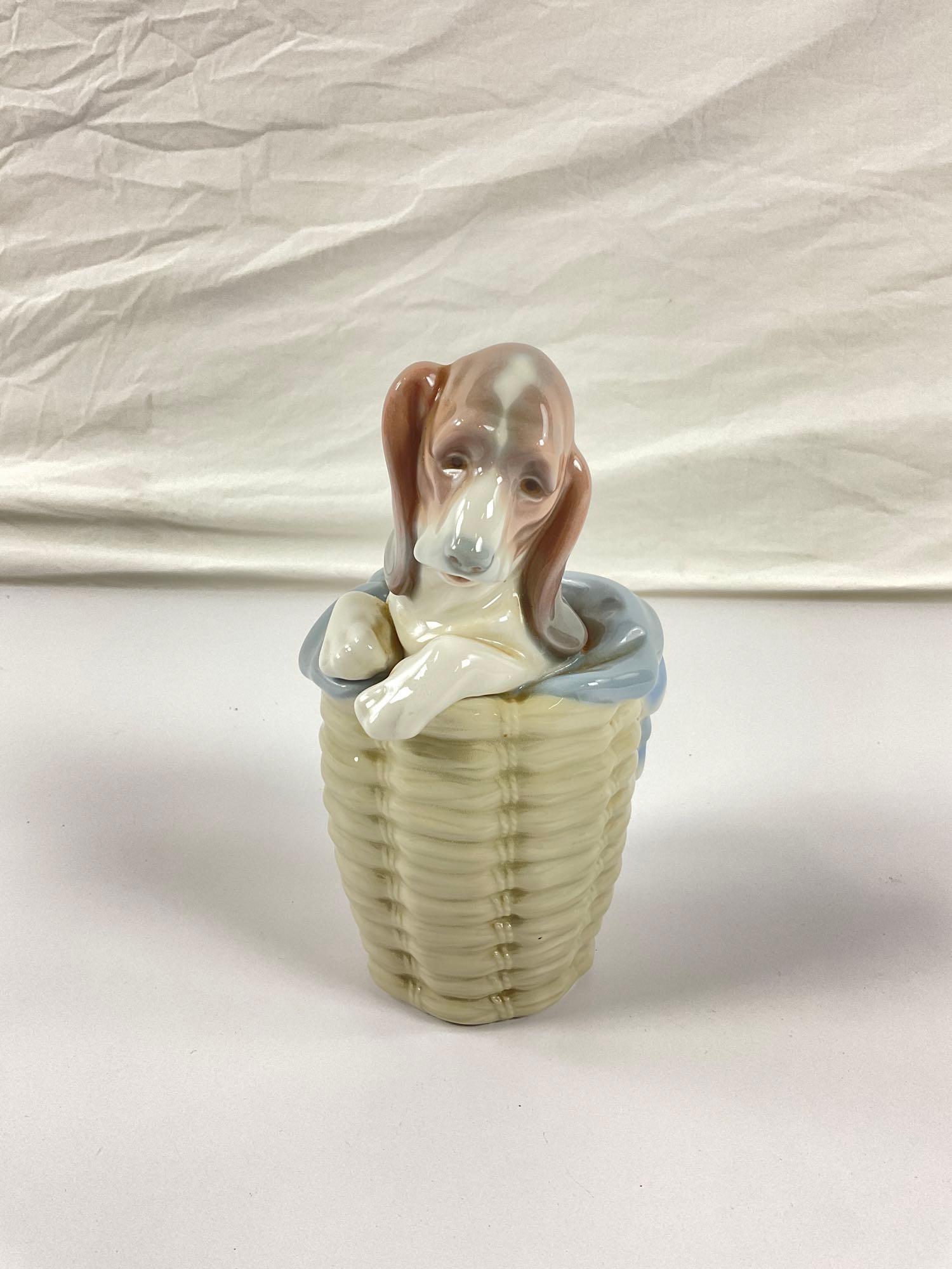beautiful Lladro dog in basket collectible figurine.