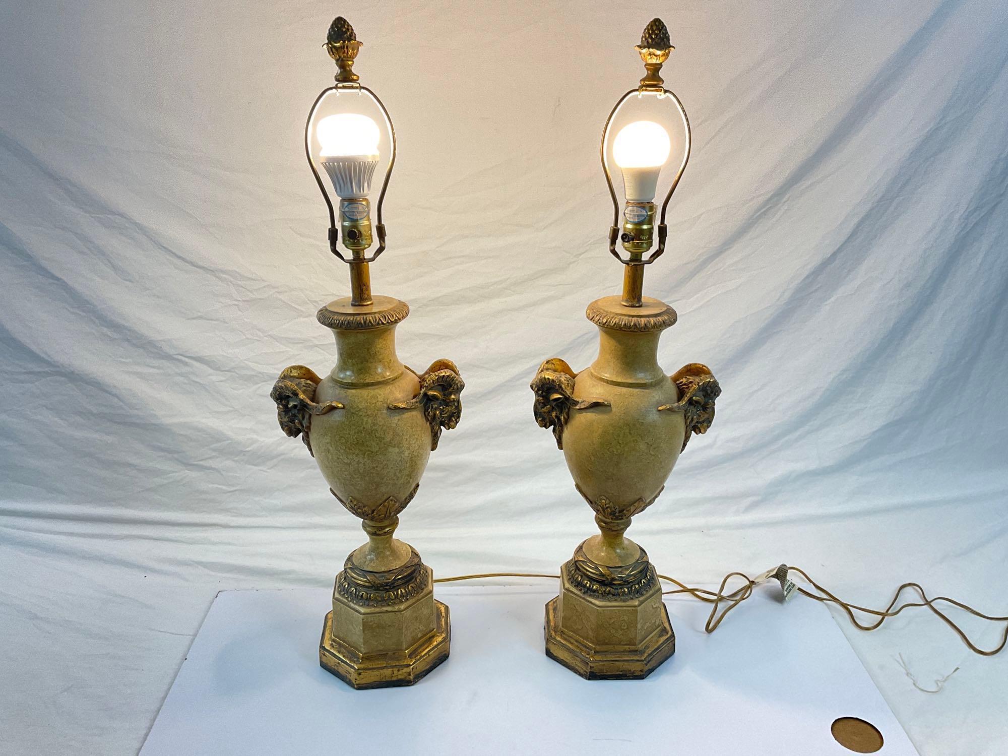 Pair of gold stone lamps with ram head accents