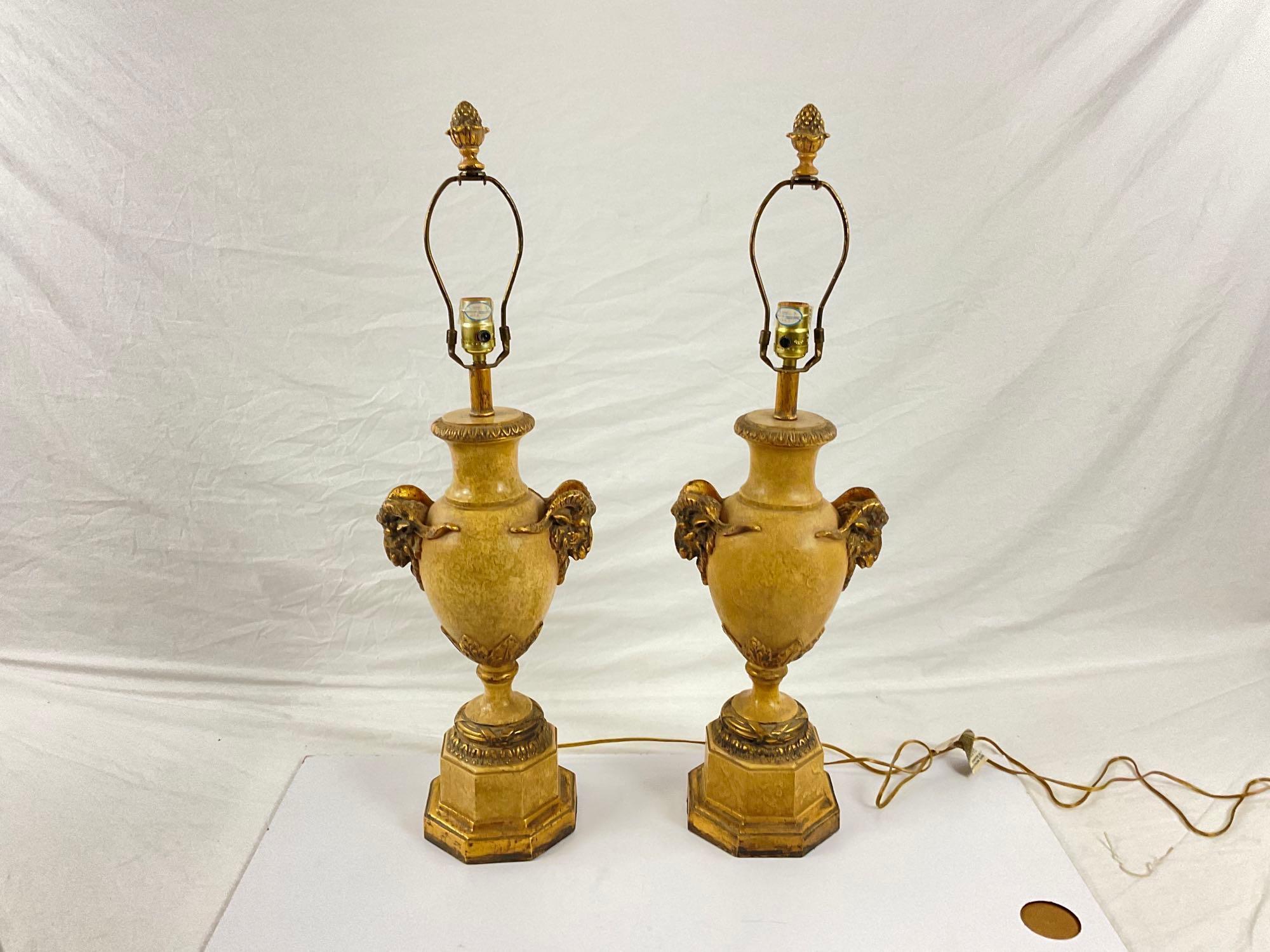 Pair of gold stone lamps with ram head accents
