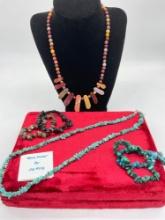 Selection of raw and polished natural stone jewelry incl. Jay King turquoise and sterling necklace