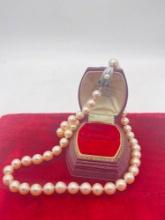 Luxurious Mikimoto 17 1/2" 9mm golden-pink hued pearl necklace with silver clasp