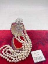 Like new w/ tag Swarovski triple strand faux pearl crystal clasp necklace w/ booklet