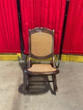 Beautiful Antique Wooden Folding Rocking Chair w/ Caned Seat & Floral Carved Back. See pics.