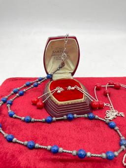 Pair of sterling silver red and blue stone bead necklaces, one with matching earring pair