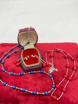 Pair of sterling silver red and blue stone bead necklaces, one with matching earring pair