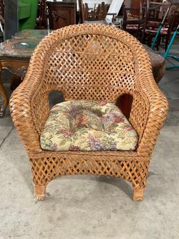 Vintage Woven Rattan Trellis Back Patio Armchair w/ Floral Cushion. Measures 31" x 36" See pics.