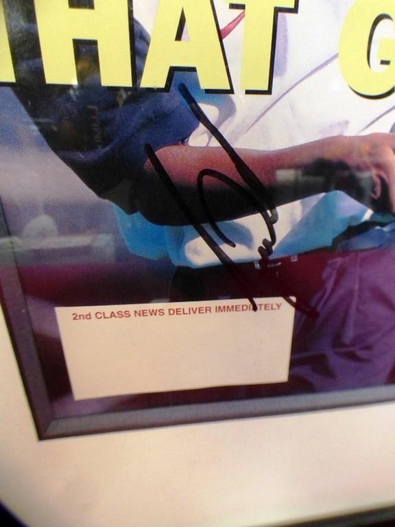 SIGNED TIGER WOODS FRAMED MAGAZINE W/ CERTIFICATE ($725.00)