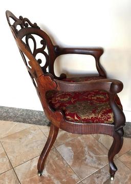 ANTIQUE AMERICAN OAK CHAIR WITH RED/GOLD PRINT ON CASTERS