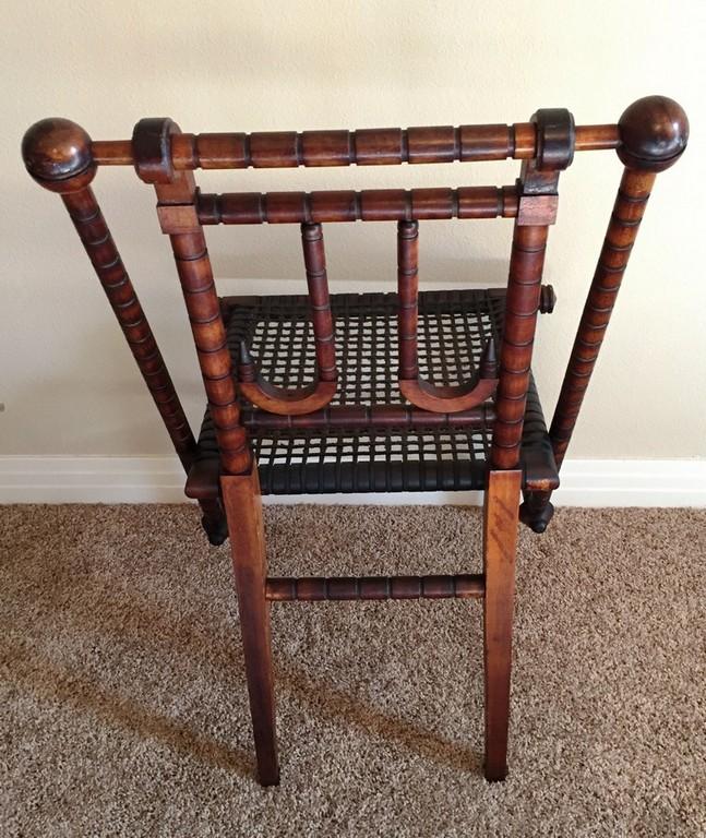 CARVED ANTIQUE SIDE CHAIR WITH CANE SEATING