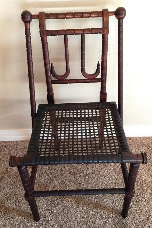 CARVED ANTIQUE SIDE CHAIR WITH CANE SEATING